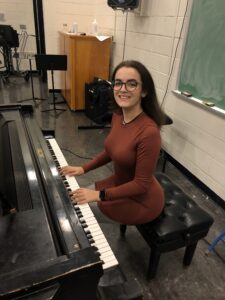 Me with a piano at SUNY Plattsburgh!