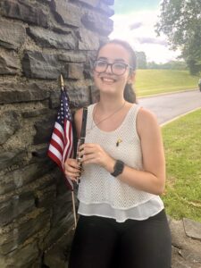 Me holding my piccolo after playing in the Fourth of July parade!