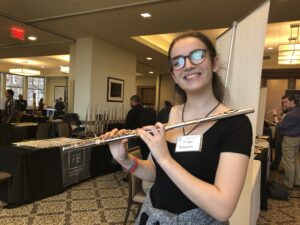 Me holding a platinum and gold Haynes flute at the NY Flute Fair!