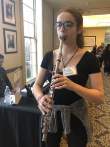 Me playing a vertical flute at the NY Flute Fair!